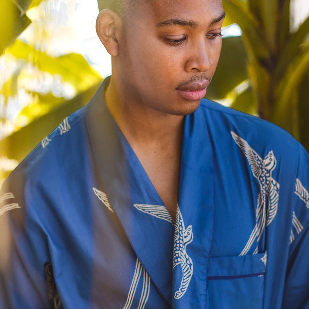 A person wearing a blue hand printed cotton dressing gown