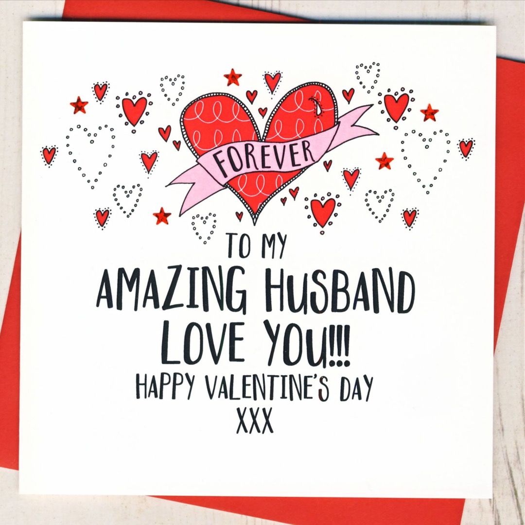 White card featuring illustrated hearts that says "To my amazing husband, love you!!! Happy Valentine's Day xxx"