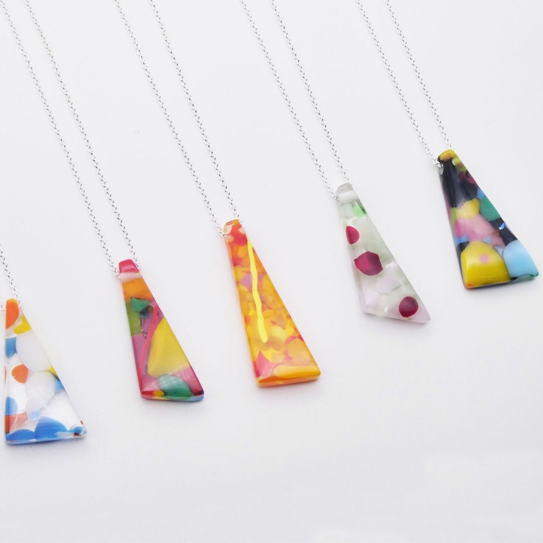 Five fused glass pendants in a "Geo glass" style