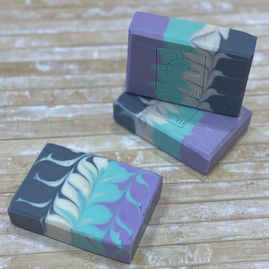three bars of patterned soap in blue and purple colours