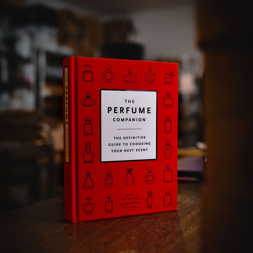 The Perfume Companion book standing on a table in a workshop