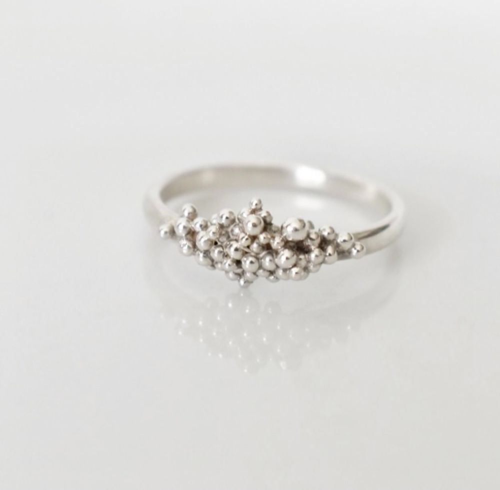 An eco silver ring featuring a cluster of baubles representing the ocean floor