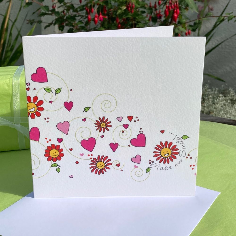 A card featuring a wave of pink flowers and hearts