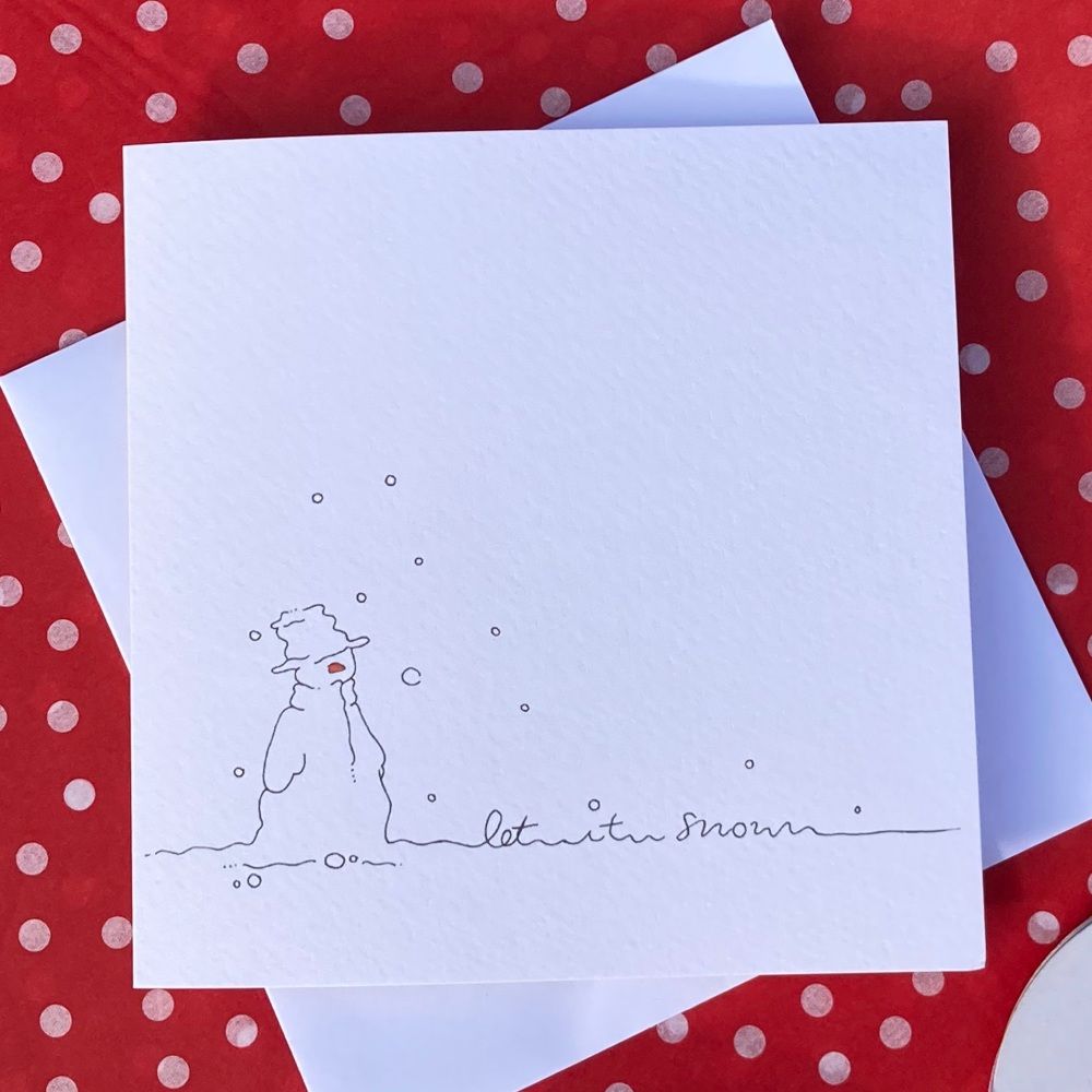 A card featuring a snow man and "Let it snow" written in the snow