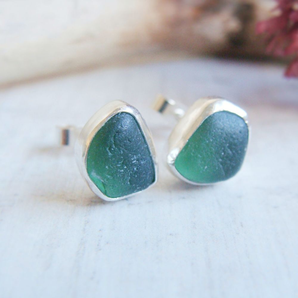 Two deep green seaglass studs encased in  sterling silver