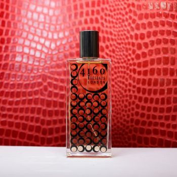 The Sexiest Scent on the Planet Ever (IMHO) perfume against a red textured backdrop