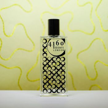 Lemon Sherbet perfume against a yellow wavy backdrop