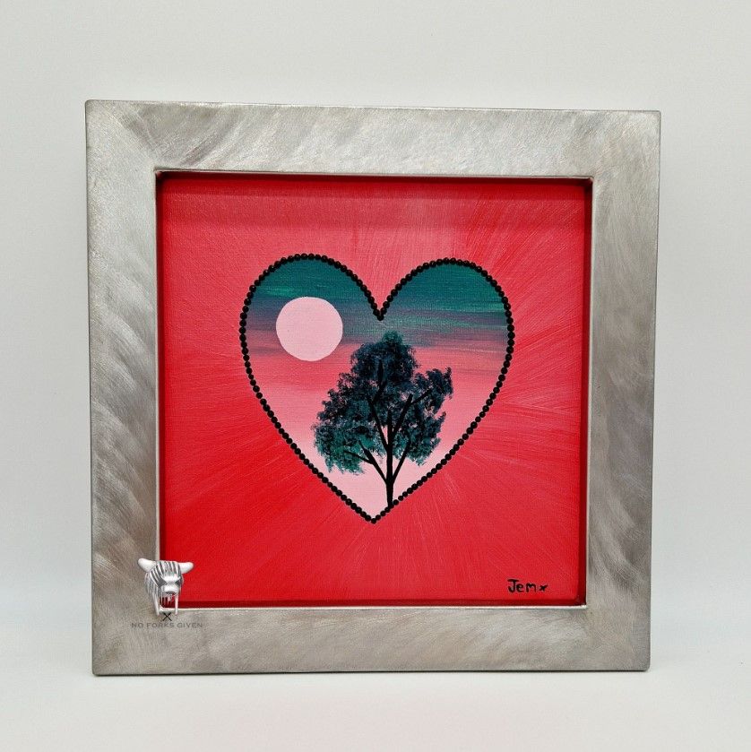 A painting of a sunset tree scene in a heart, surrounded with a steel frame