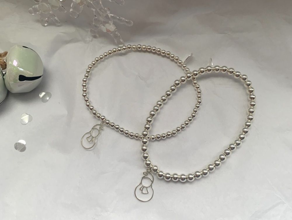 Two sterling silver bead bracelets with silver snowmen charms