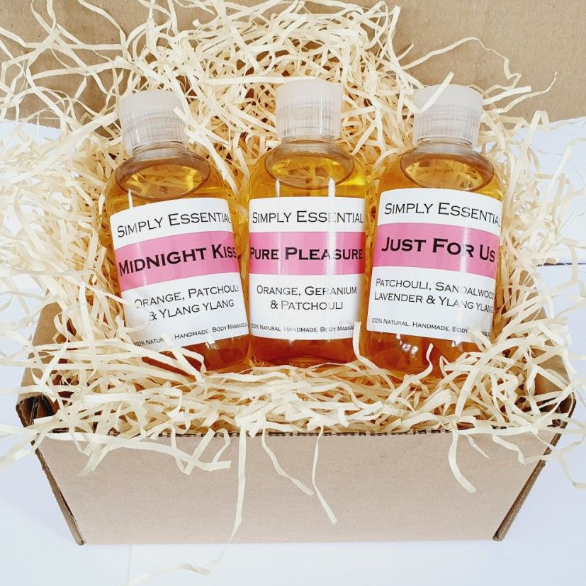 Three romantic bottles of aromatherapy oil presented in a gift box