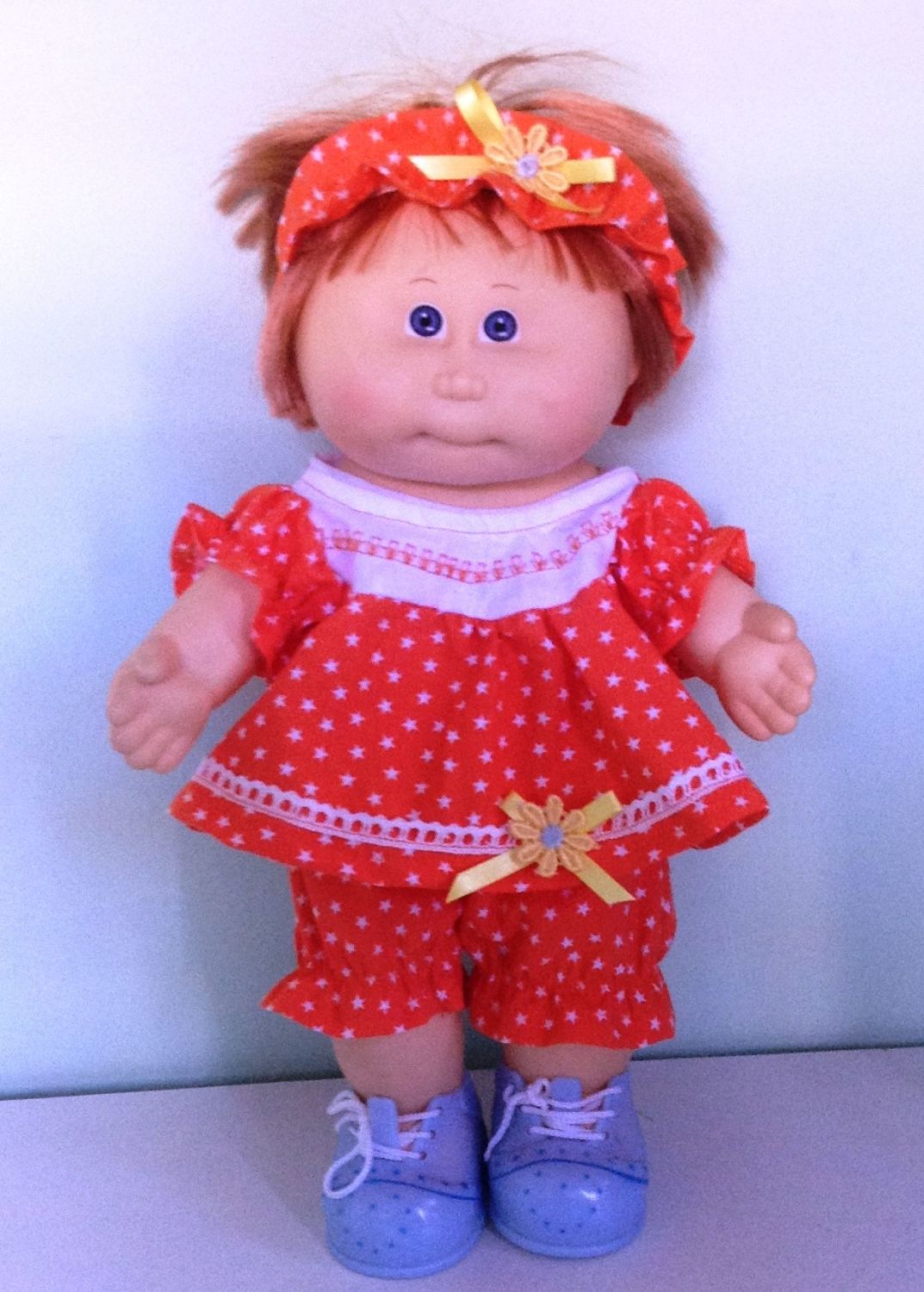 Doll's romper suit and Alice band in red starprint fabric to fit 14 inch hi