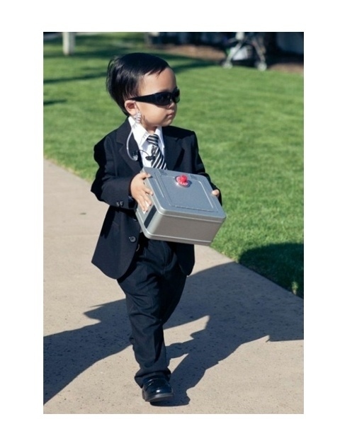 A fun wedding idea of turning your ring bearer into a super important secur