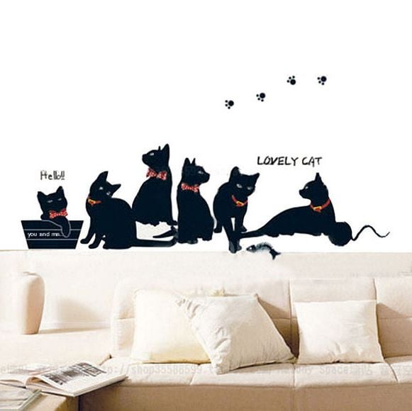 Cats wall art stickers to decorate a lounge wall above a sofa