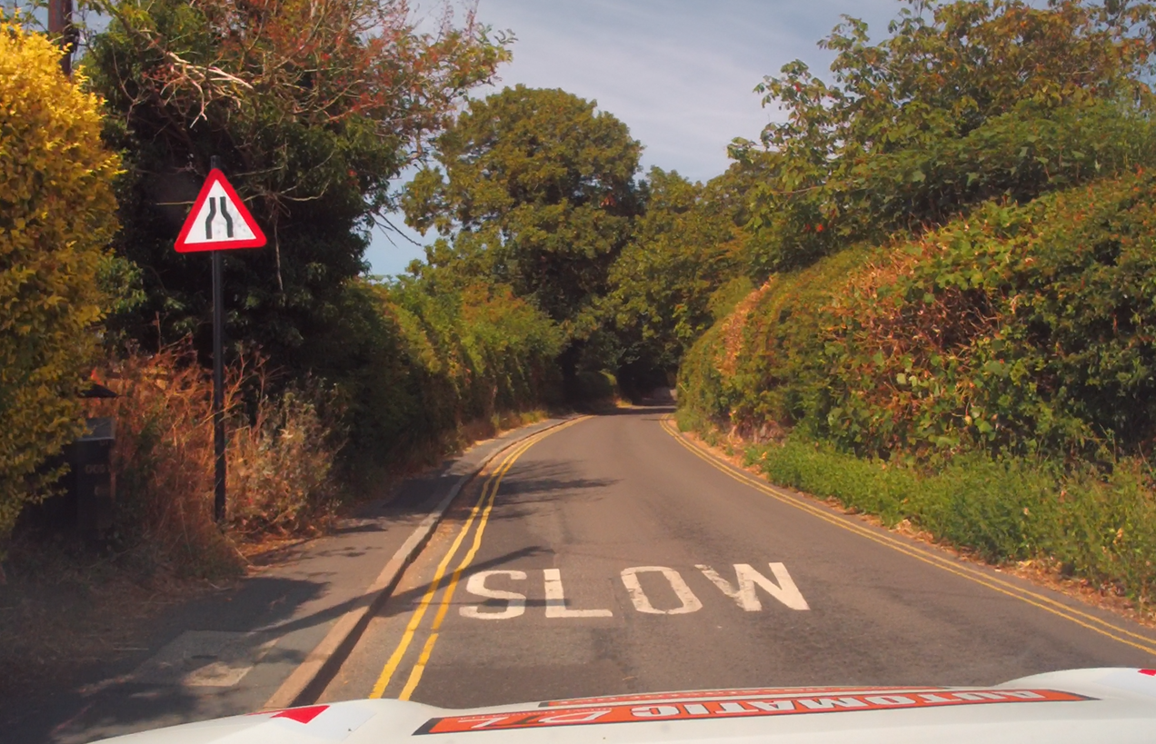 What should you do when you see this sign? When you see the Road Narrows on Both Sides sign you should: &acirc;&cent;	Reduce your speed early.  &acirc;&cent;	Look well ahead for oncoming traffic.  &acirc;&cent;	Check your mirrors.  &acirc;&cent;	Watch for cyclists, motorcyclists and pedestrians.  &acirc;&cent;	Be prepared to give way if the road becomes too narrow.  &acirc;&cent;	Leave extra space from parked vehicles.  &acirc;&cent;	Stay in your normal road position unless it is unsafe to do so.  Never assume two large vehicles can pass comfortably.