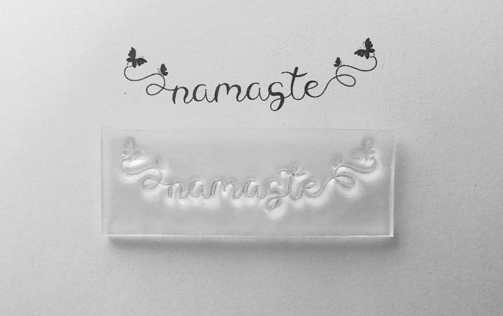 Namaste stamp with butterflies