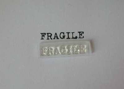 Fragile stamp, typewriter font 