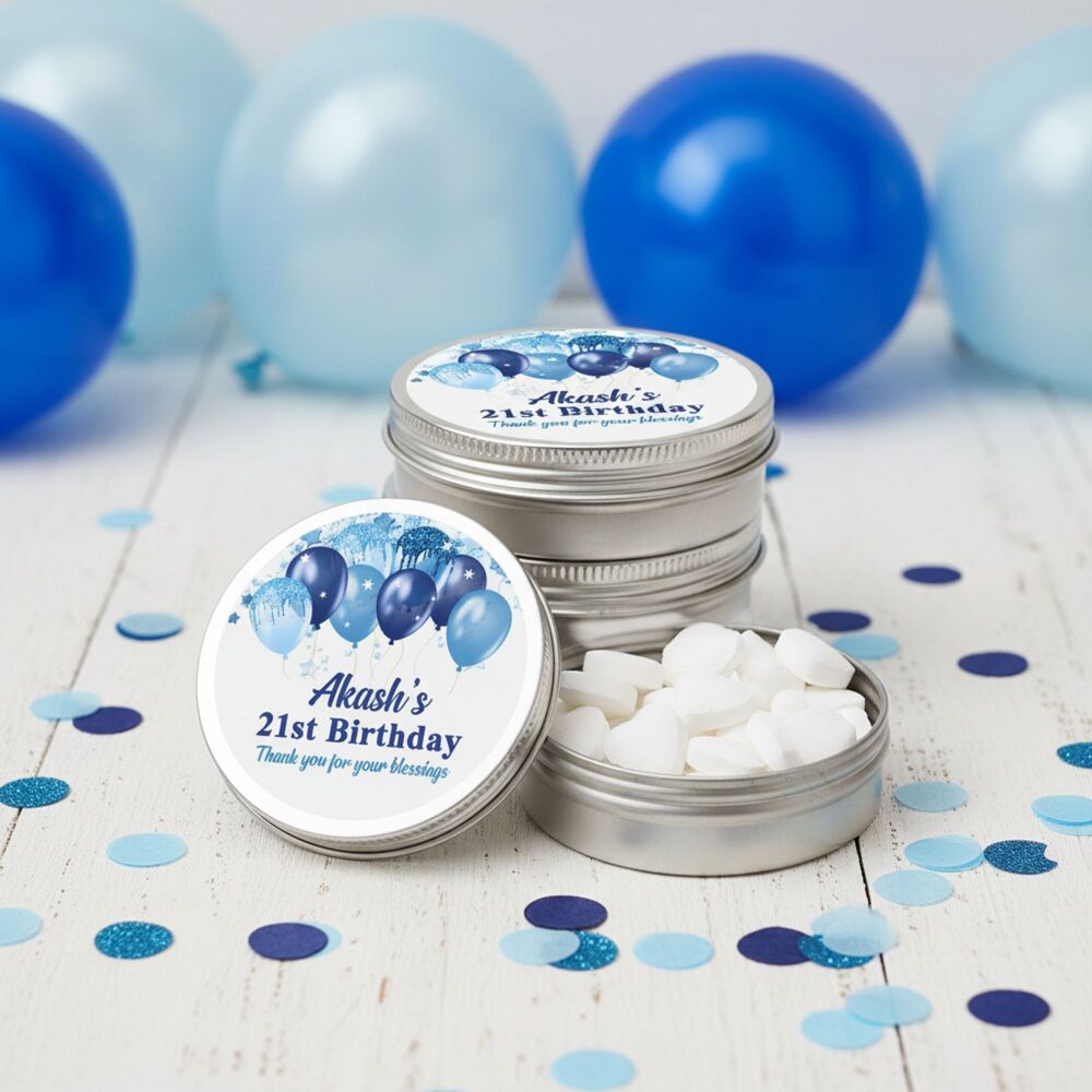 Personalised party favours mint tins with blue balloons.