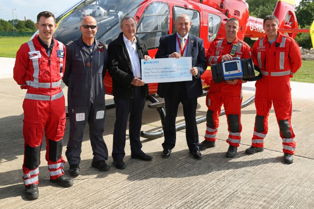 s Nick Mason makes cheque presentation to the Midlands Air Ambulance Charit