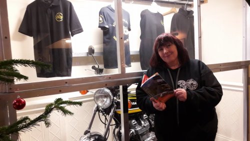Karen at Squires with 6th edition booklet
