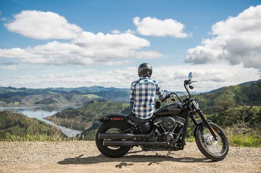 Man sitting on Motorcycle - on Unsplash
