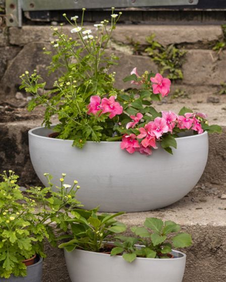 This Large White Oval Recycled Plant Pot is made from recycled materials