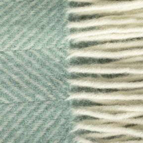This is the National Trust Fishbone Wool Throw, Seafoam Green