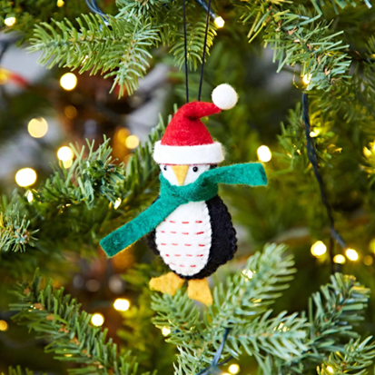 How about some Christmas decorations, such as this felt penguin in a Santa hat?  