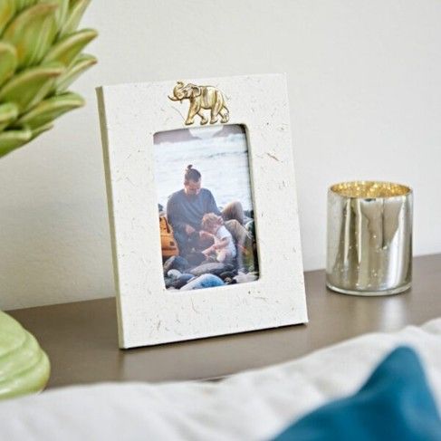 Paper High have a number of photo frames you could give as a gift, including this Elephant Dung Photo Frame