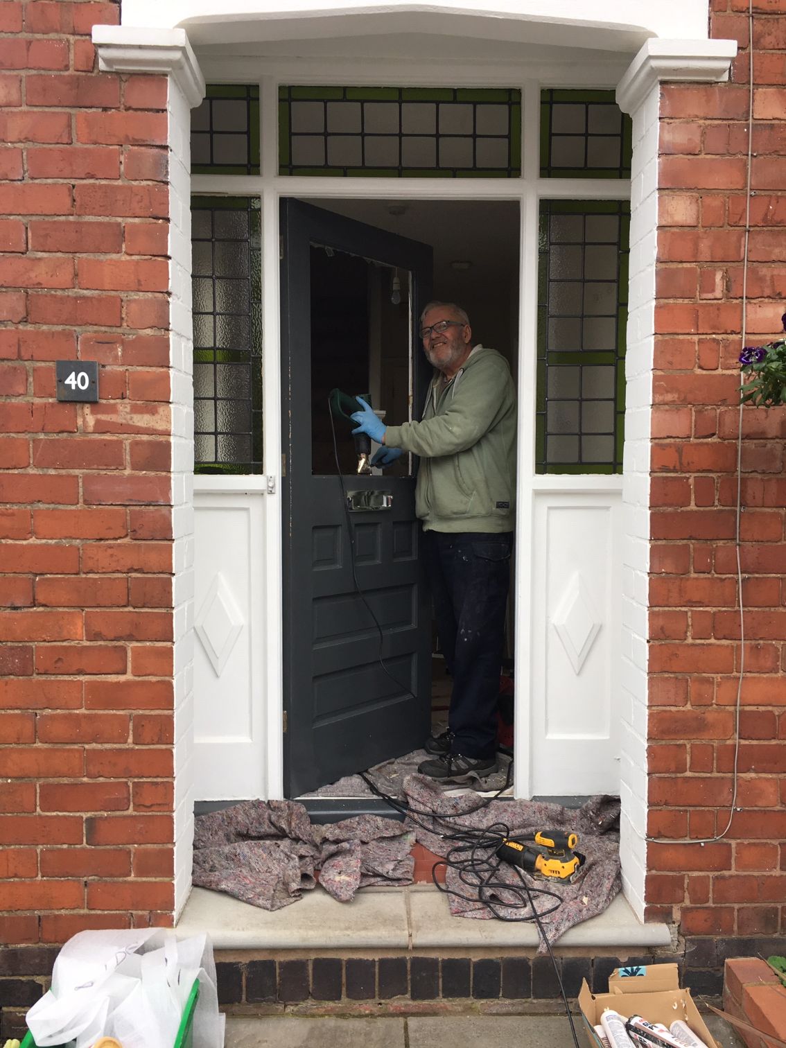 Peter from the Stained Glass Studio installing a client front door window