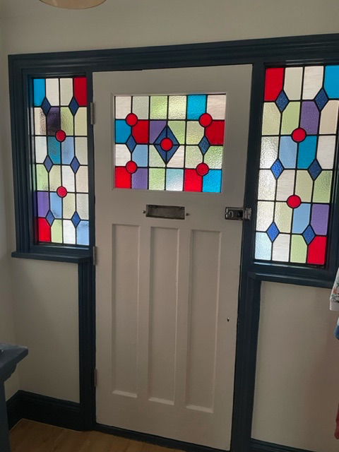 Traditional painted stained glass in front door
