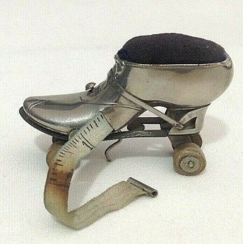 Antique novelty roller skate shoe tape measure pin cushion 