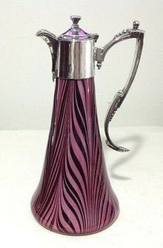 Antique raspberry swirl glass claret jug silver plated mounts signed Montgomery