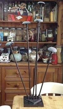 Antique shop display hat stand with 5 stands articulated at the base