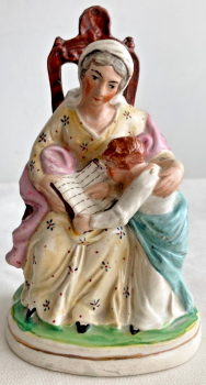 Antique staffordshire figure Mother reading book to young girl