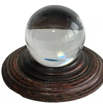 Antique or Vintage glass fortune telling crystal ball on wooden stand