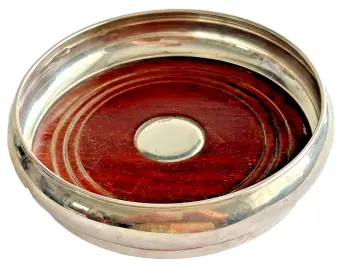 A vintage sterling silver wine bottle coaster hallmarked Birmingham 1997