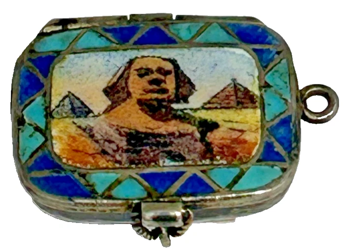 A Antique sterling silver Egyptian Revival enamel moses basket charm locket