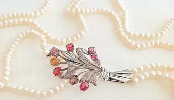 Antique Arts & Crafts pearl necklace sterling silver flower spray clasp set with Garnet stones Bernard Instone