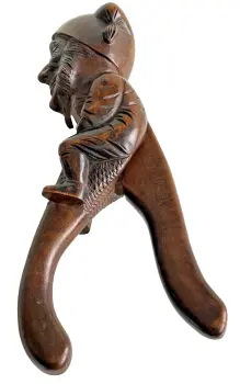 Antique carved Black Forest nutcrackers gnome sat astride handle novelty
