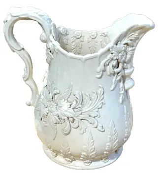 A Antique style embossed jug Signed P Weldon creamware Staffordshire