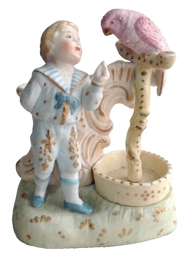 Antique Victorian boy feeding parrott match striker German