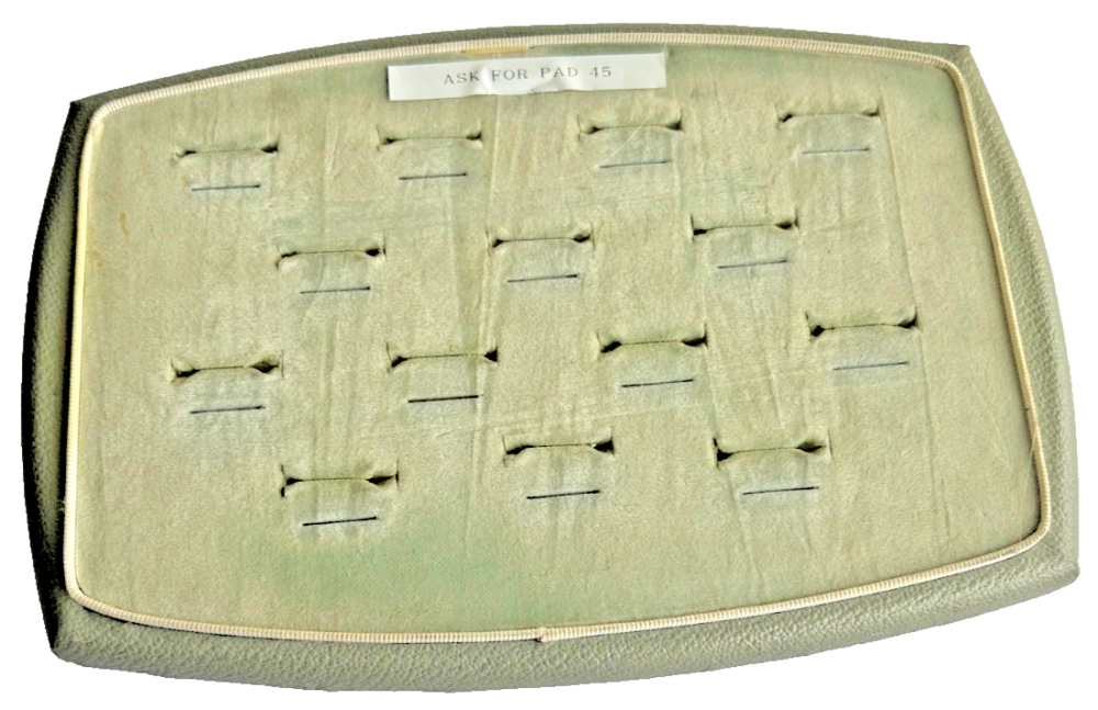 A Vintage jewellery jeweller shop display pad ring wedding rings