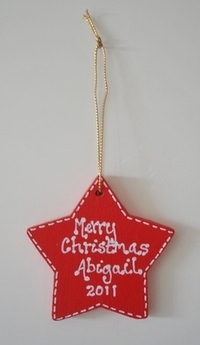 personalised red painted star christmas decoration 
