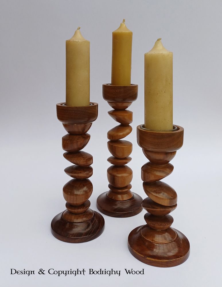Tryptic 'tipsy' Candlesticks