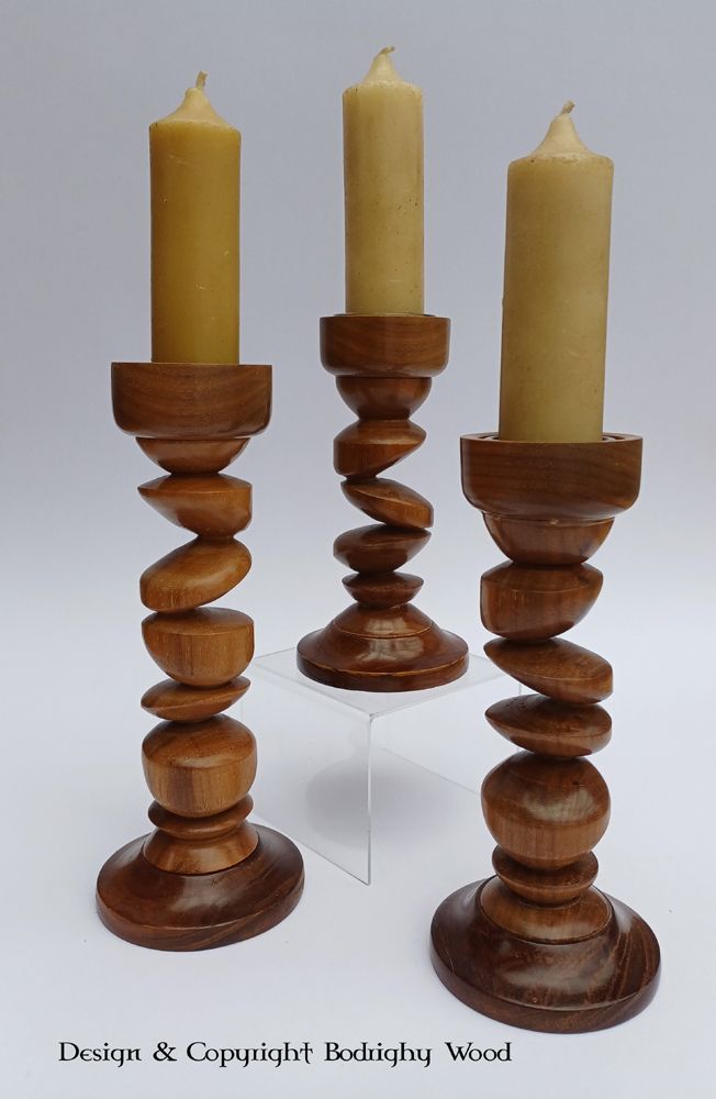 Tryptic 'tipsy' Candlesticks
