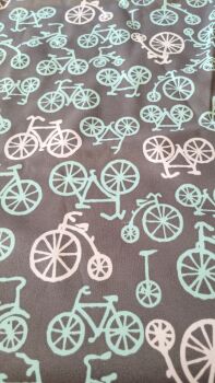 Soft touch fabric with a plastic coated back featuring bicycles