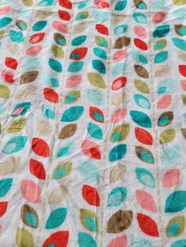 Soft fabric with colourful leaves on a white background