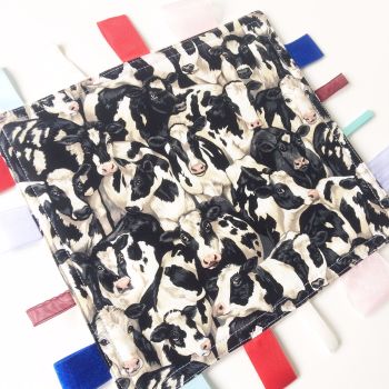 Cow print baby taggy blanket