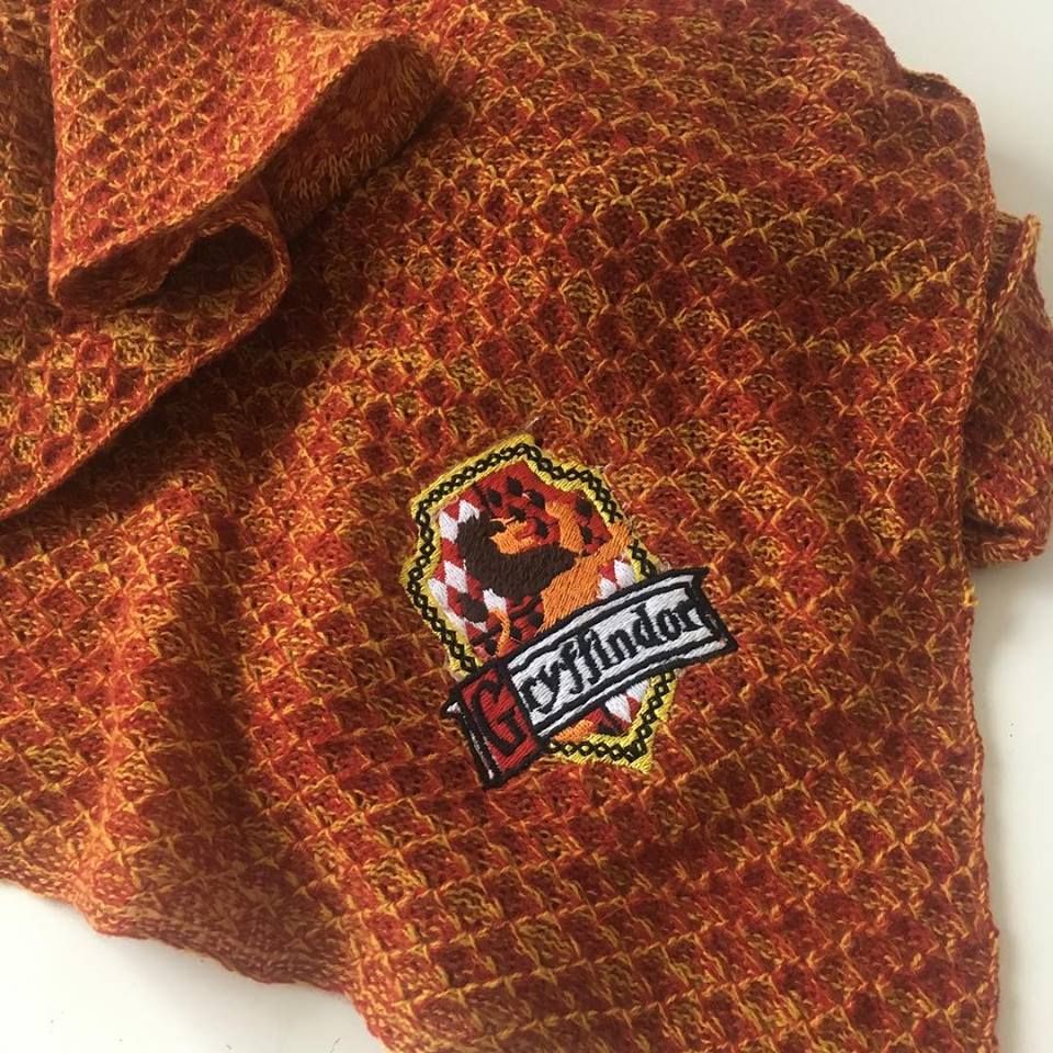 Knitted magical red and gold baby blanket
