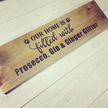 Our home is filled with  Prosecco gin and ginger glitter wooden sign